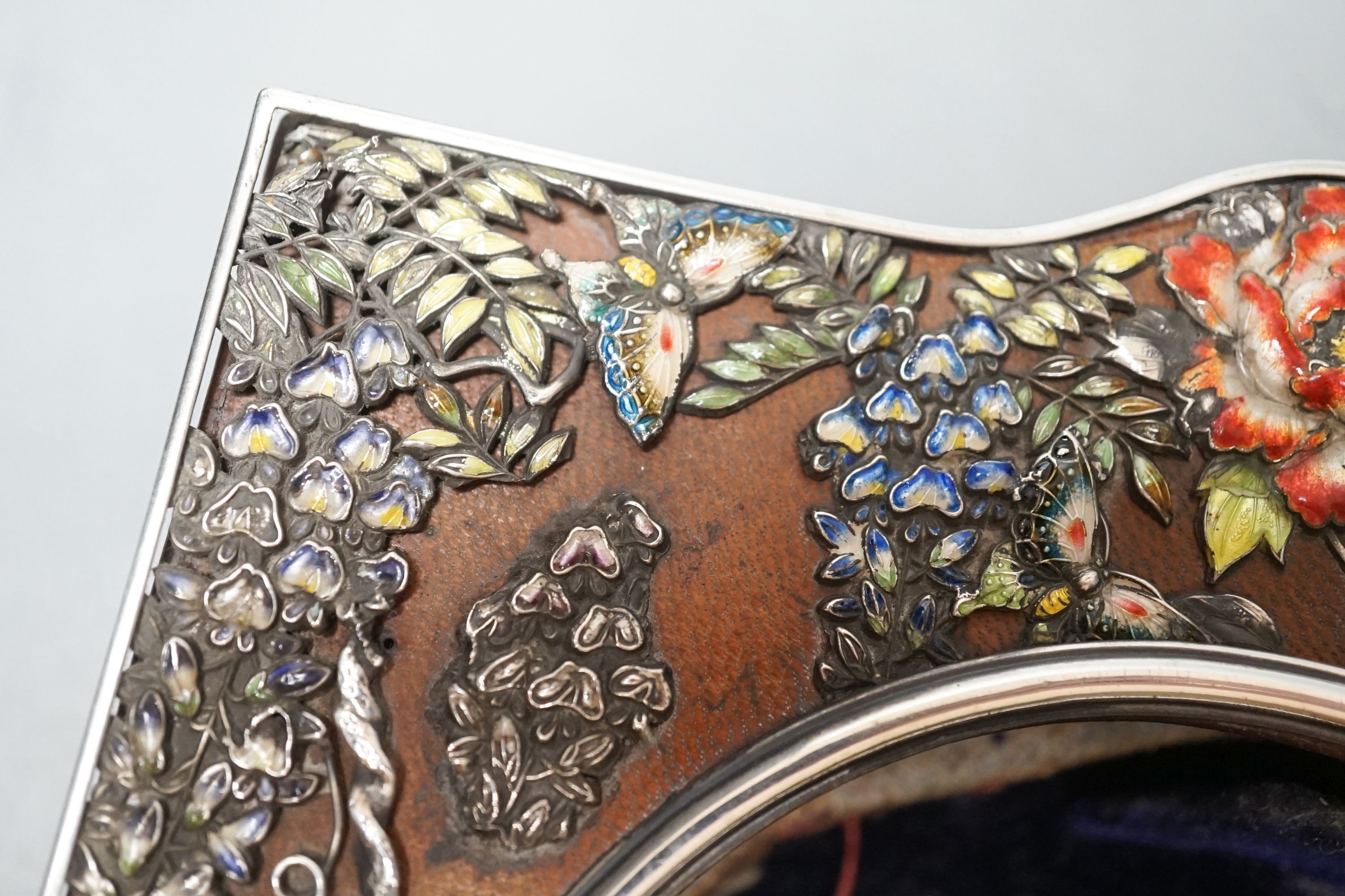 An early 20th century Japanese? white metal and polychrome enamel mounted leather travelling watch case, decorated with flowers and birds, 16.2cm.